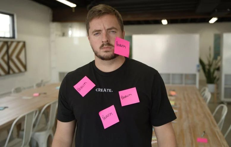 Johnny covered in pink problem post-its
